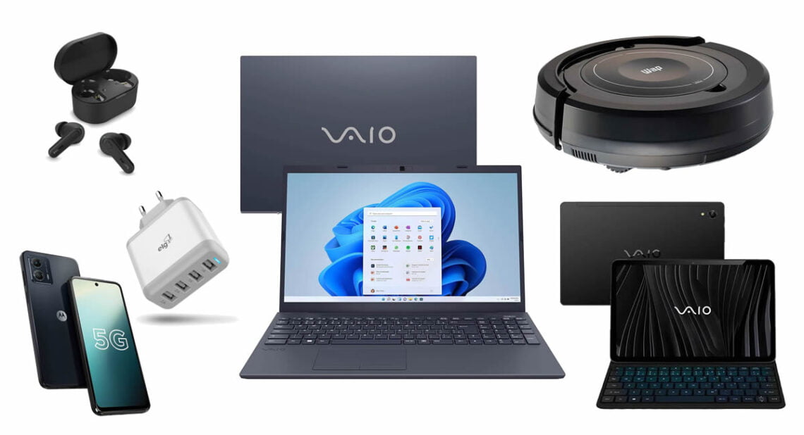 Coleção de dispositivos eletrônicos, incluindo fones de ouvido sem fio, smartphone 5G, carregador USB, notebook e tablet VAIO com teclado, e um robô aspirador.